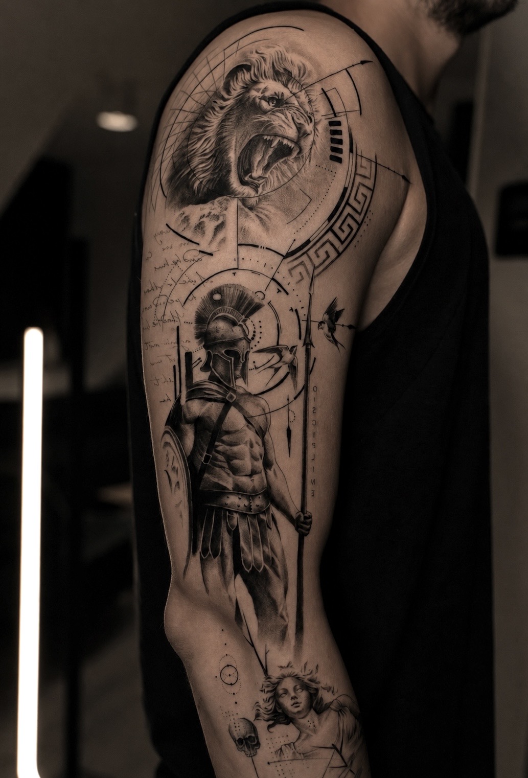 Fine line religious composition on a forearm