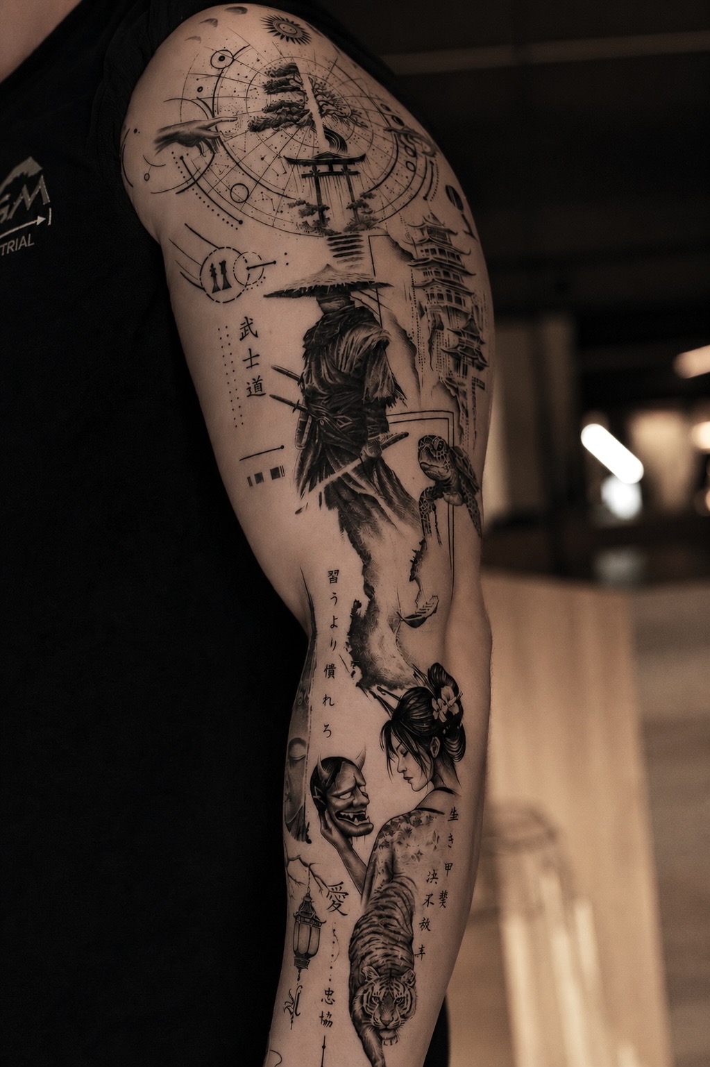 Detailed black and grey figure tattoo